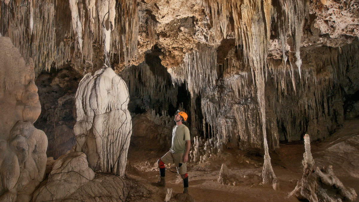 Philip Rykwalder stands on the bottom of a cave