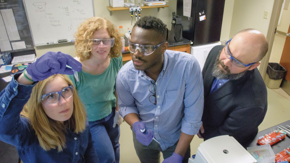 Sharon Crary works with students in the lab