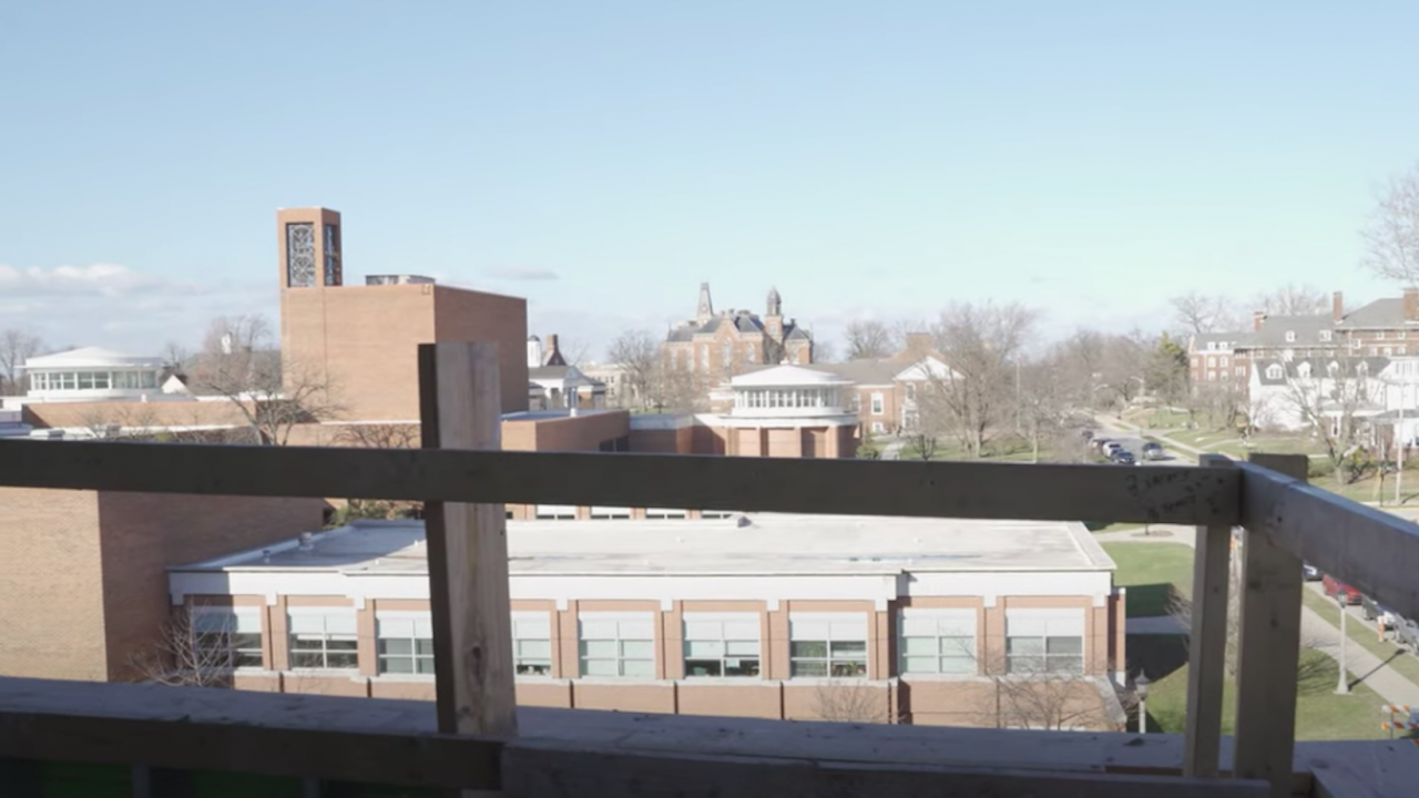 Photo looking out the balcony of Res Hall 1 toward East College 