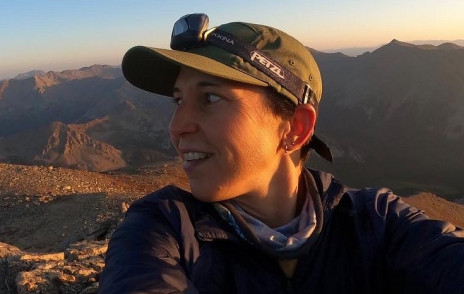 Runner Micah Ling on top of a mountain