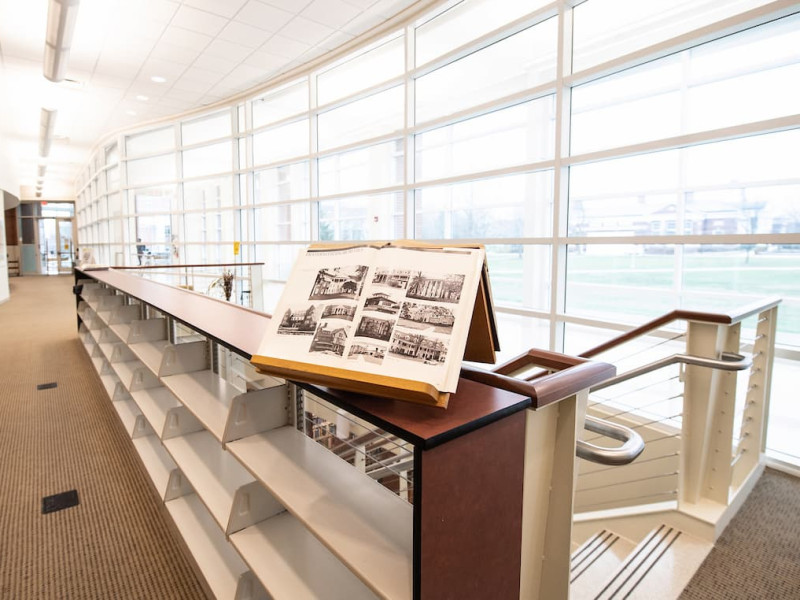 Open historical photo album displayed in GCPA window hallway