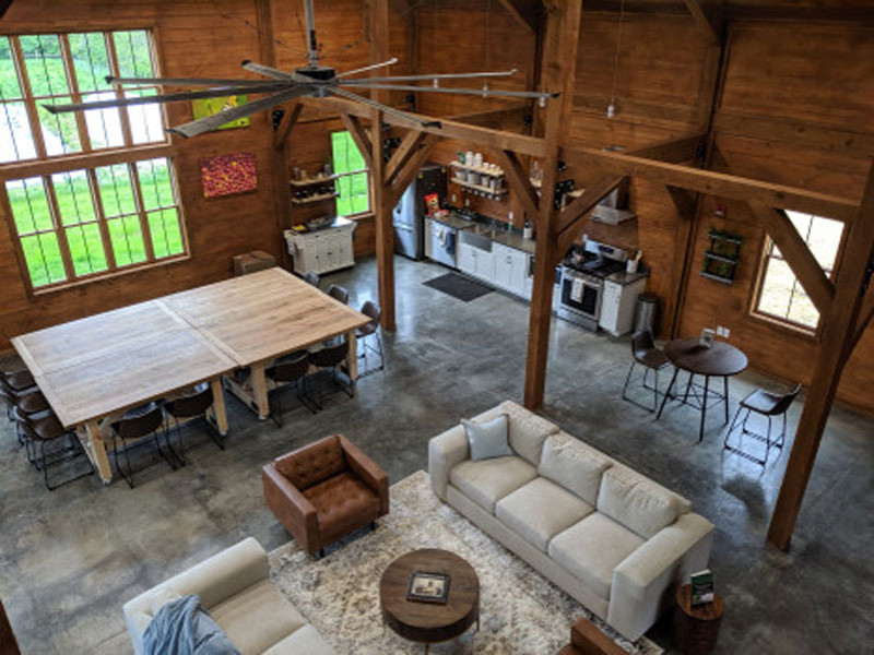 Modern barn interior with kitchen and seating area