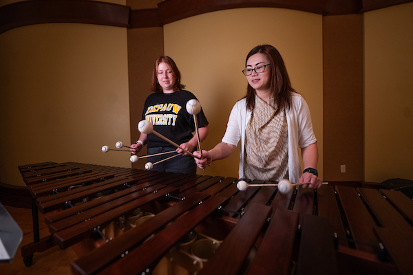 Students playing the xylophone