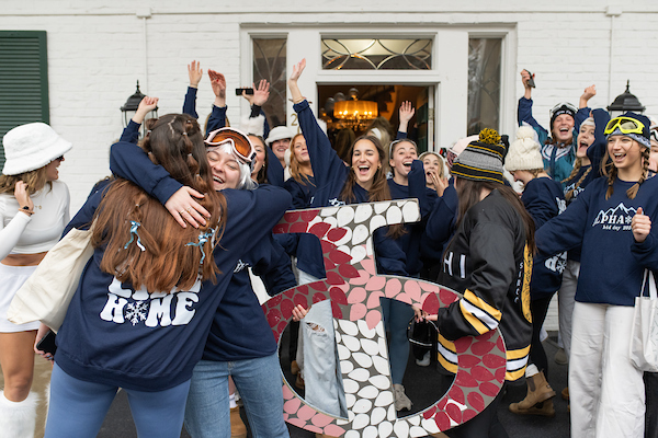 Students hugging during a sorority event